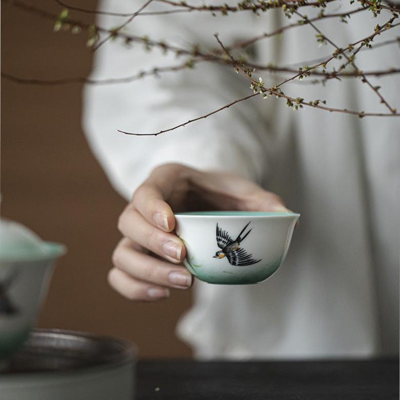 this is a ceramic teapot. this is a green gaiwan