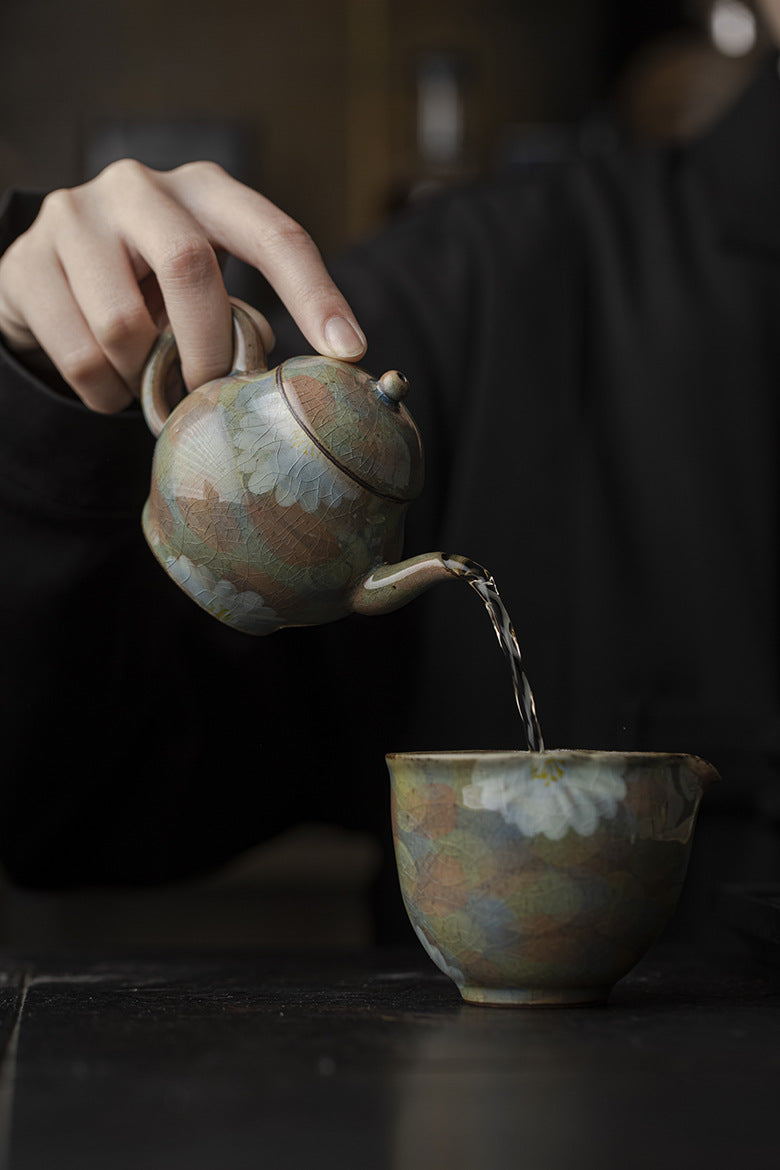 This is a ceramic teapot.this is an iced crackled teapot