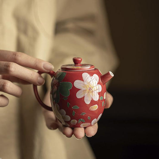 this is a ceramic teapot. this is a red teapot