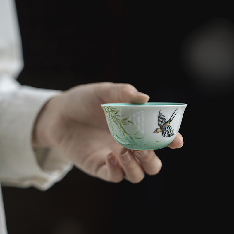 this is a ceramic teapot. this is a green gaiwan