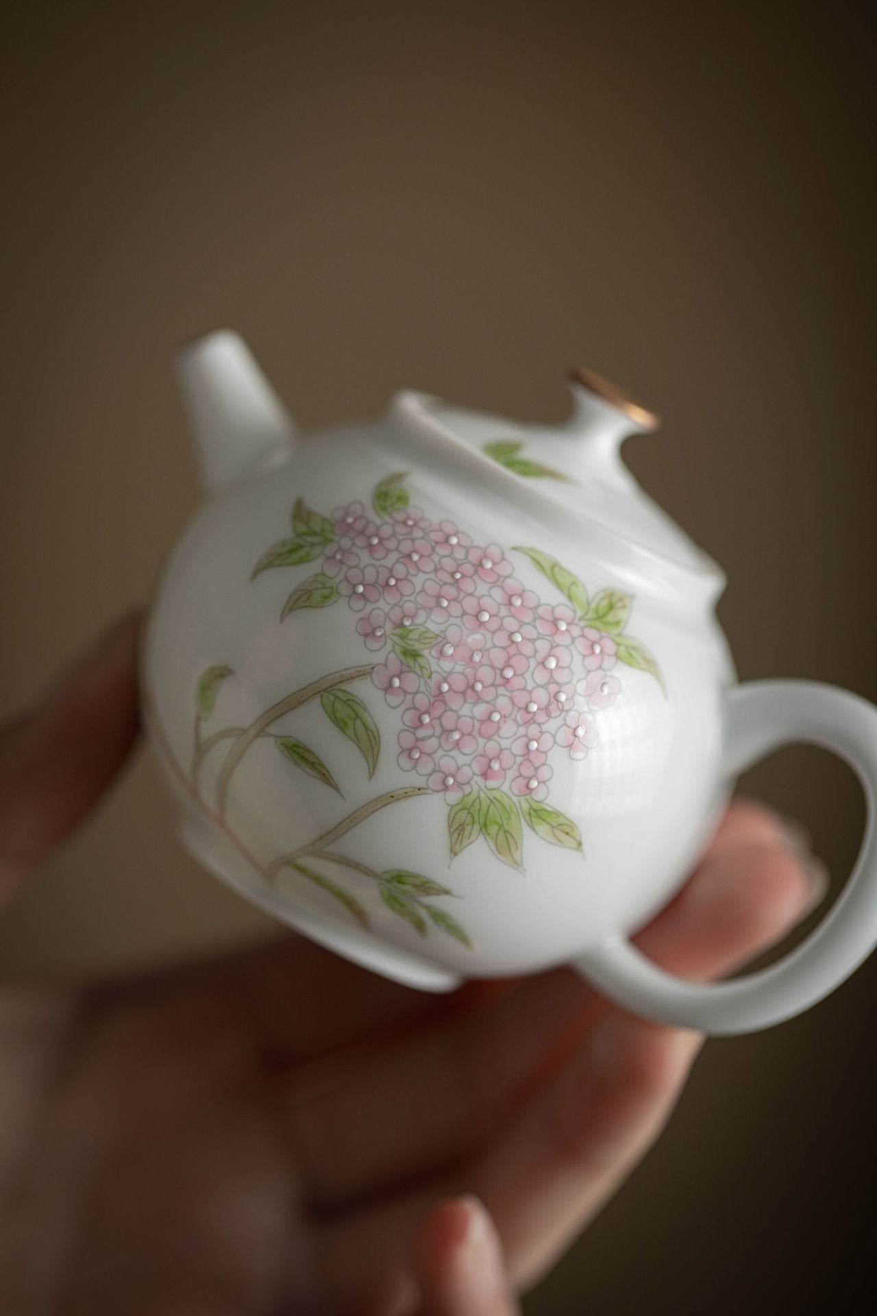 This is a ceramic teapot