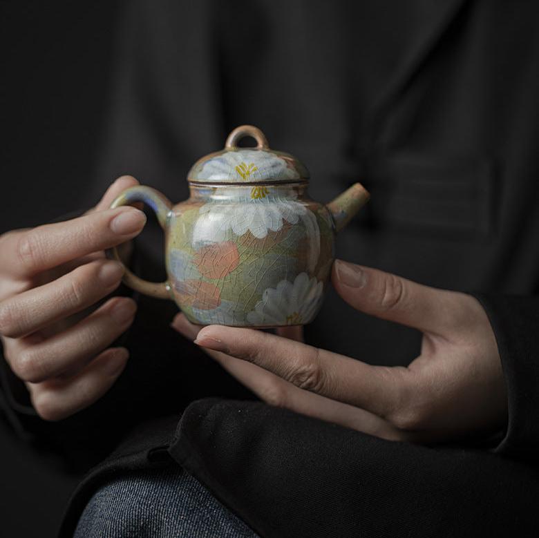 This is a ceramic teapot.this is an iced crackled teapot