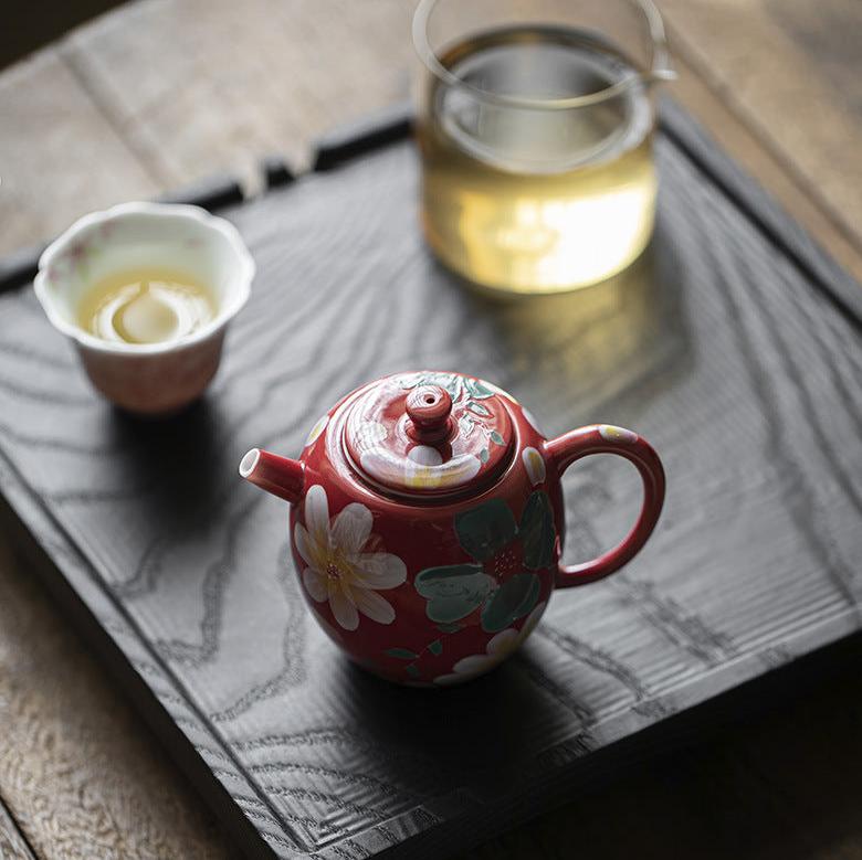 this is a ceramic teapot. this is a red teapot