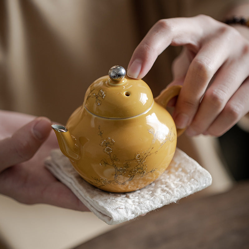 This is a ceramic teapot