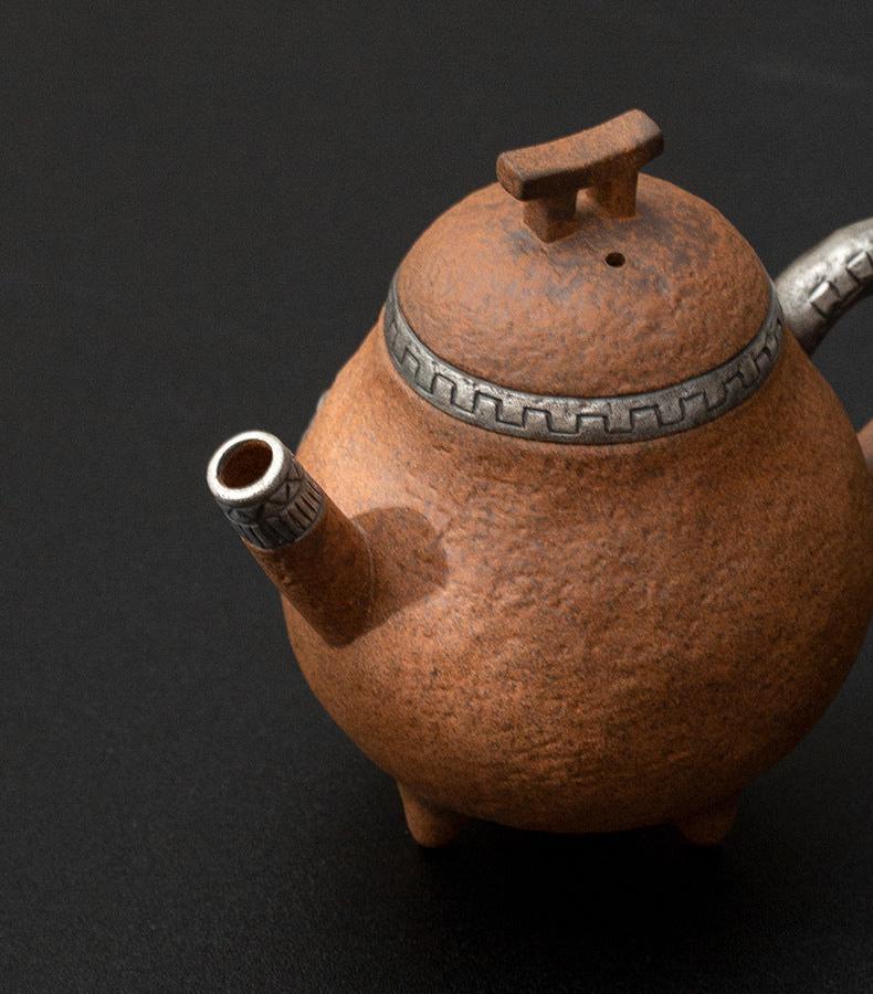 this is a pottery teapot. this is a pear teapot