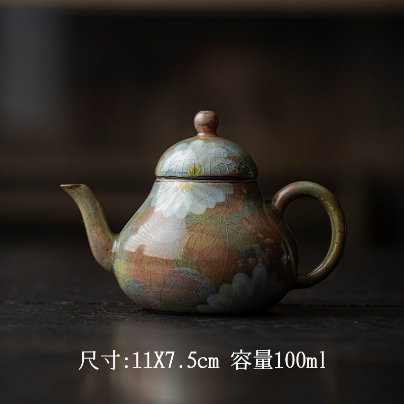 This is a ceramic teapot.this is an iced crackled teapot