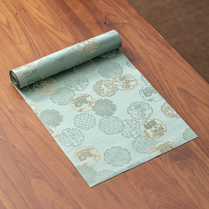 This is a silk brocade tea mat.this is a waterproof table cloth