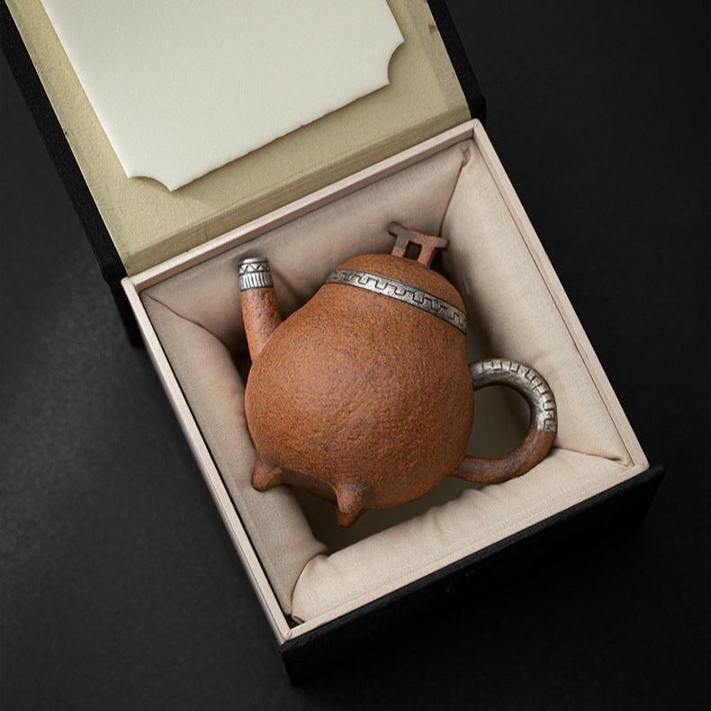 this is a pottery teapot. this is a pear teapot