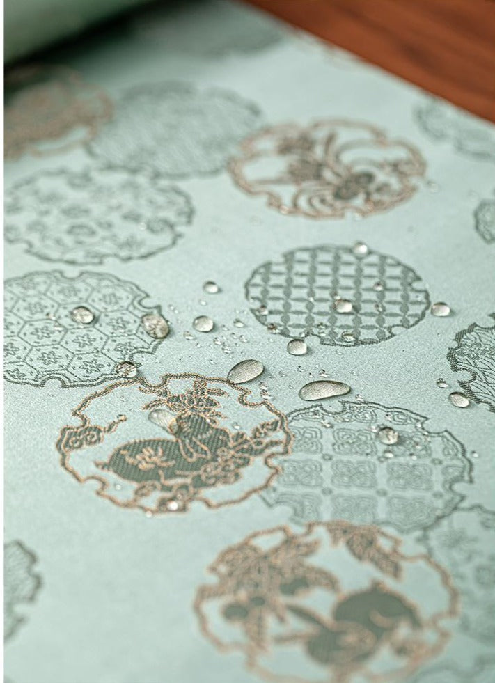 This is a silk brocade tea mat.this is a waterproof table cloth