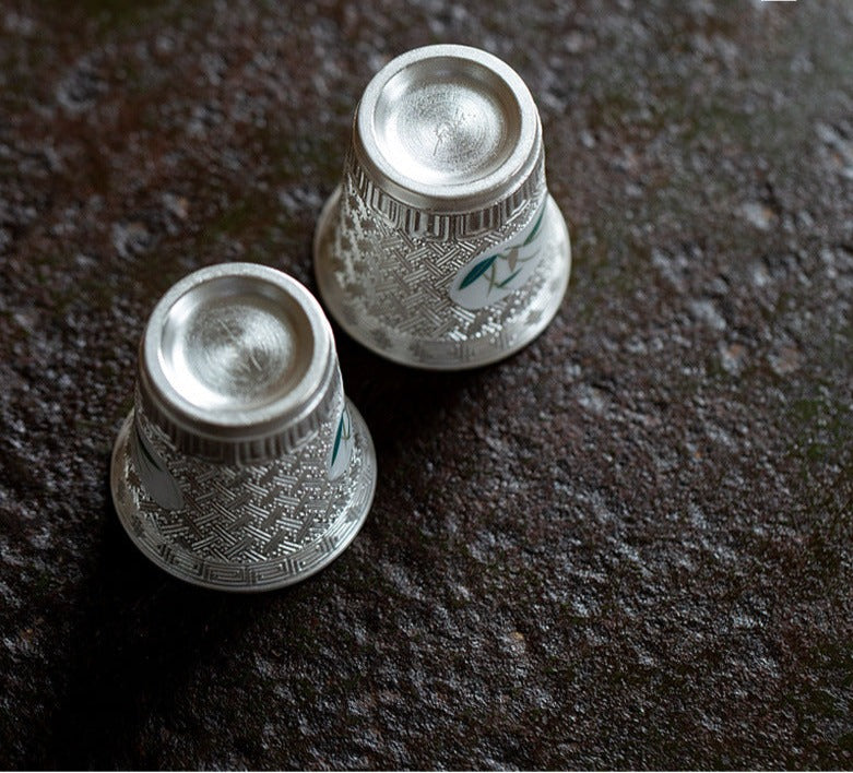 This is a gilted silver ceramic teapot