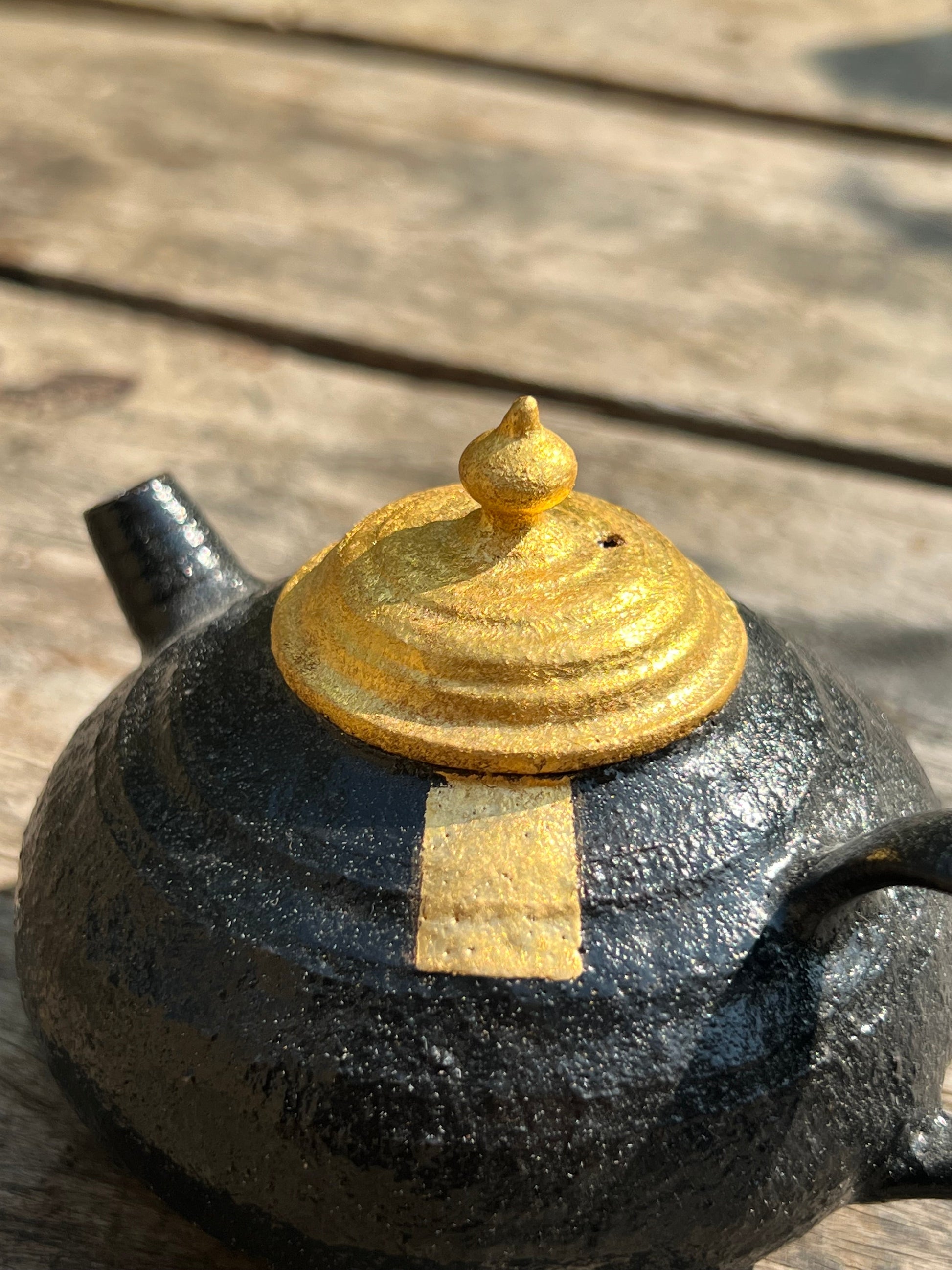 this is Chinese lacquer ware. this is a pottery teapot