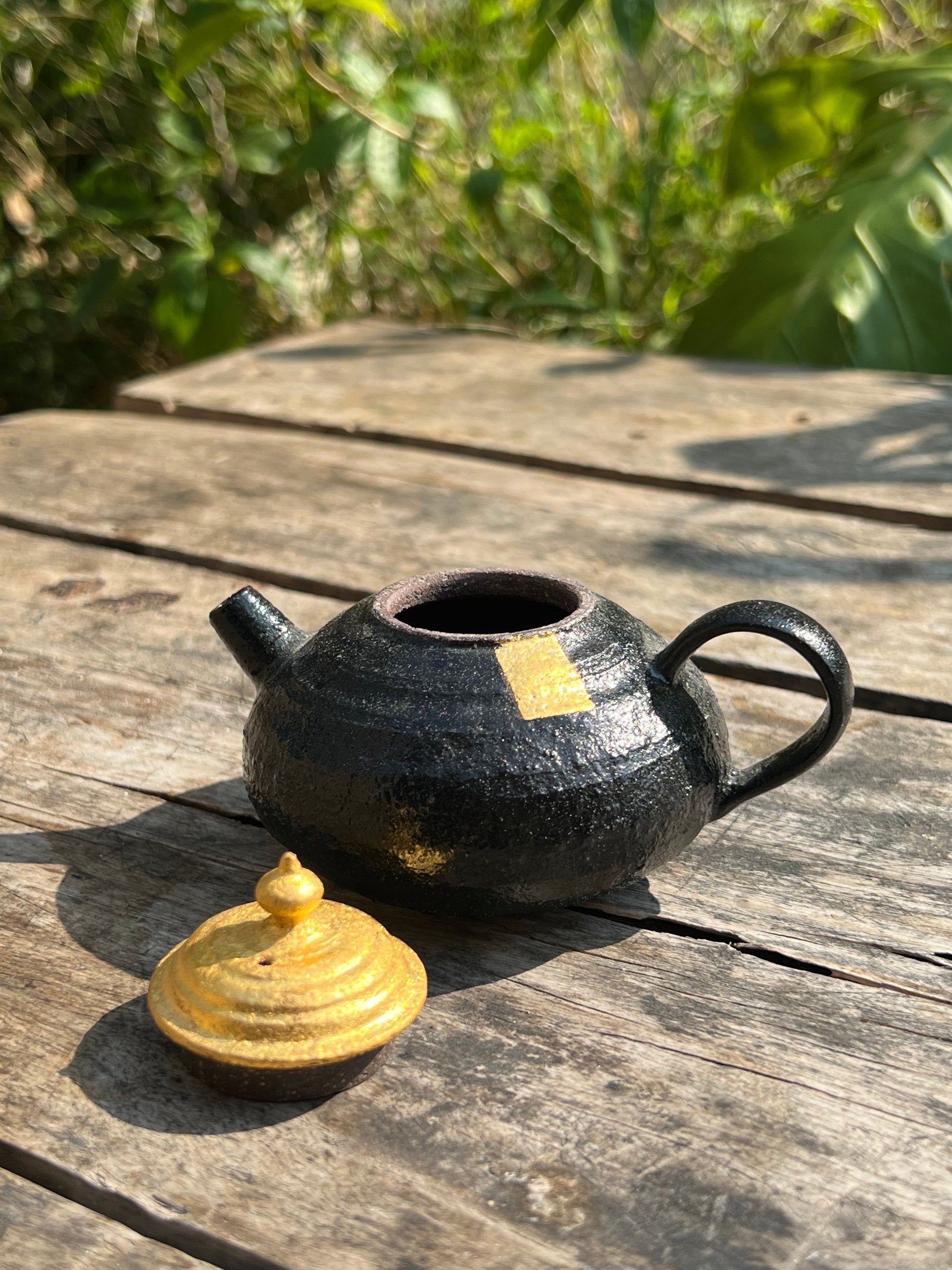 this is Chinese lacquer ware. this is a pottery teapot