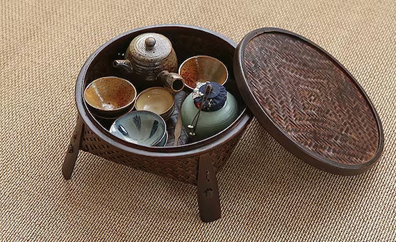 This is a bamboo weaving storage tea table