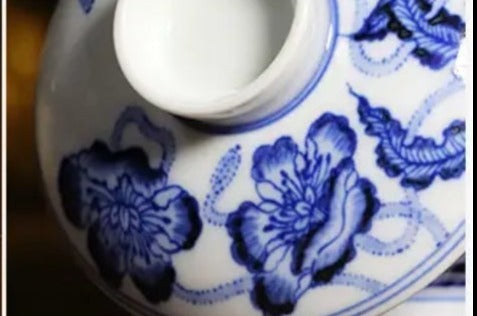 This is a Chinese Jingdezhen blue and white porcelain flower teapot