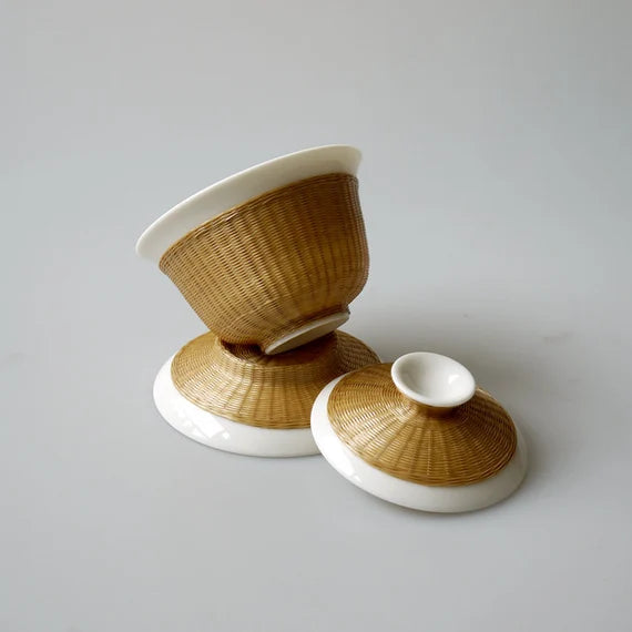 This is a ceramic teapot.this is bamboo woven teapot