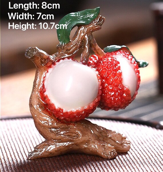 This is a color changing litchi lychee teapet.this is a resin teapet