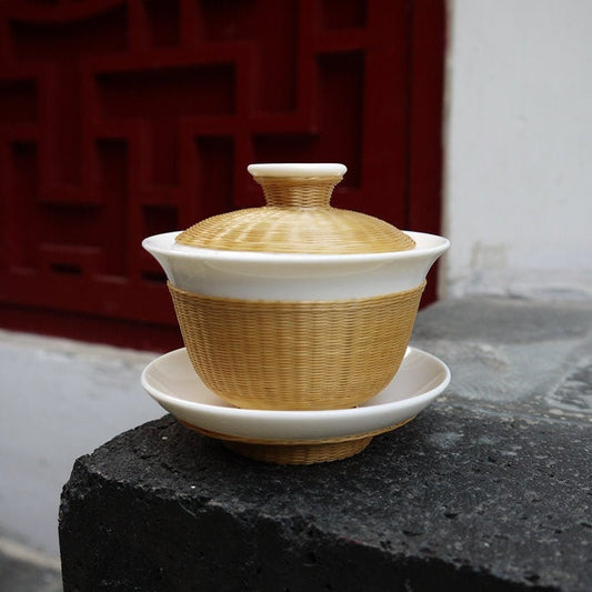 This is a ceramic teapot.this is bamboo woven teapot