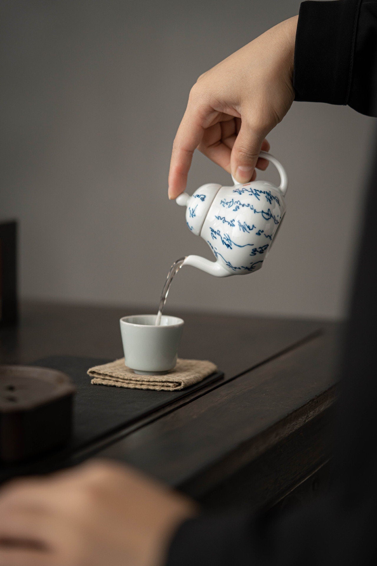 This is a white ceramic teapot