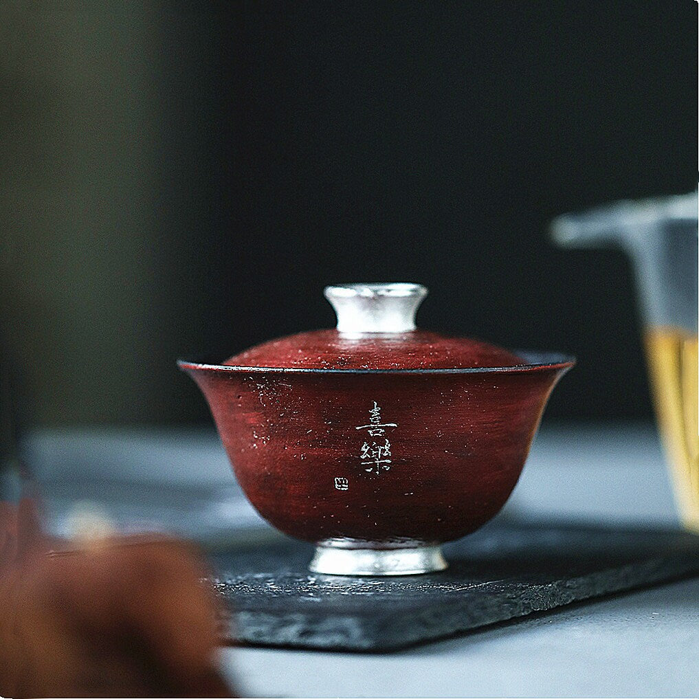 This is a gilted silver pottery teapot