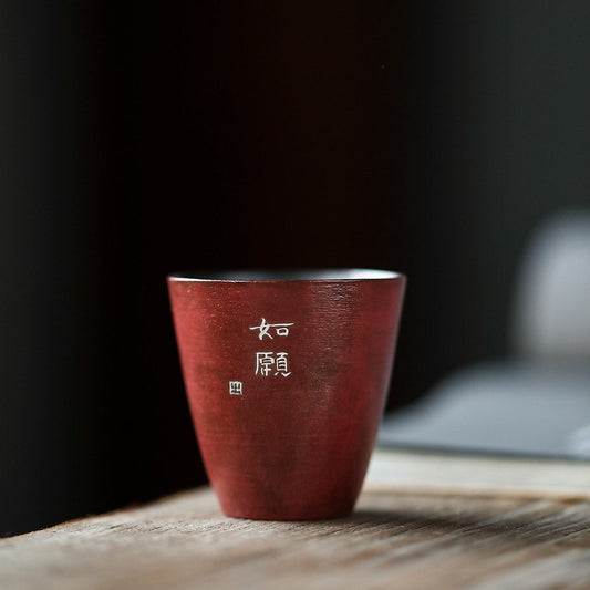 This is a pottery teacup.This is a gilted silver teacup